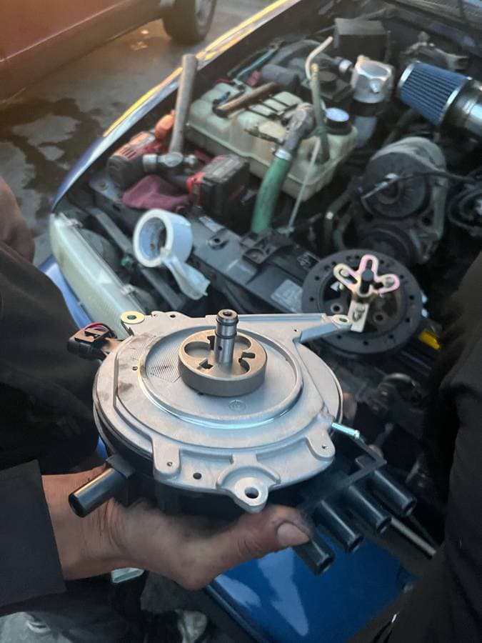 Engine bay detailing with hood open and components cleaned