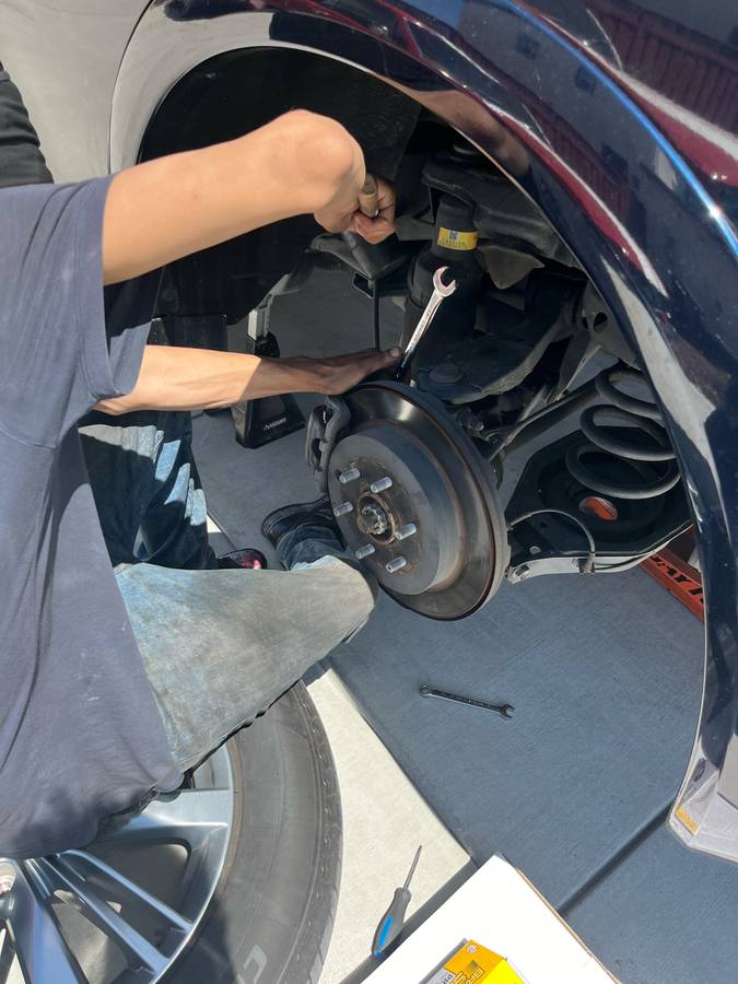 Mobile auto detailing service in the Bay Area featuring polished blue car exterior with showroom shine