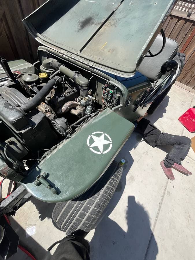 Close-up exterior auto detailing showcasing glossy paint finish and detailed headlight restoration